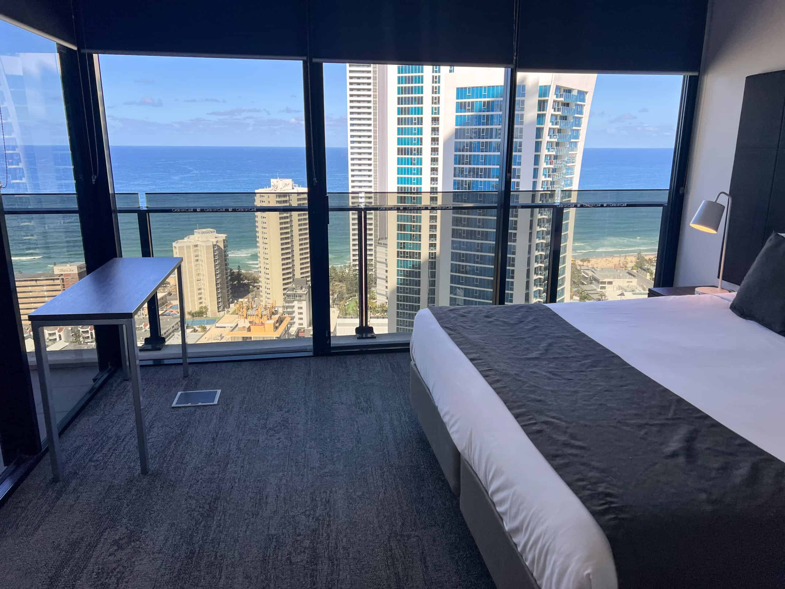 Interior of a One-Bedroom Spa Apartment at Mantra Circle on Cavill, with floor-to-ceiling windows and city-to-ocean view