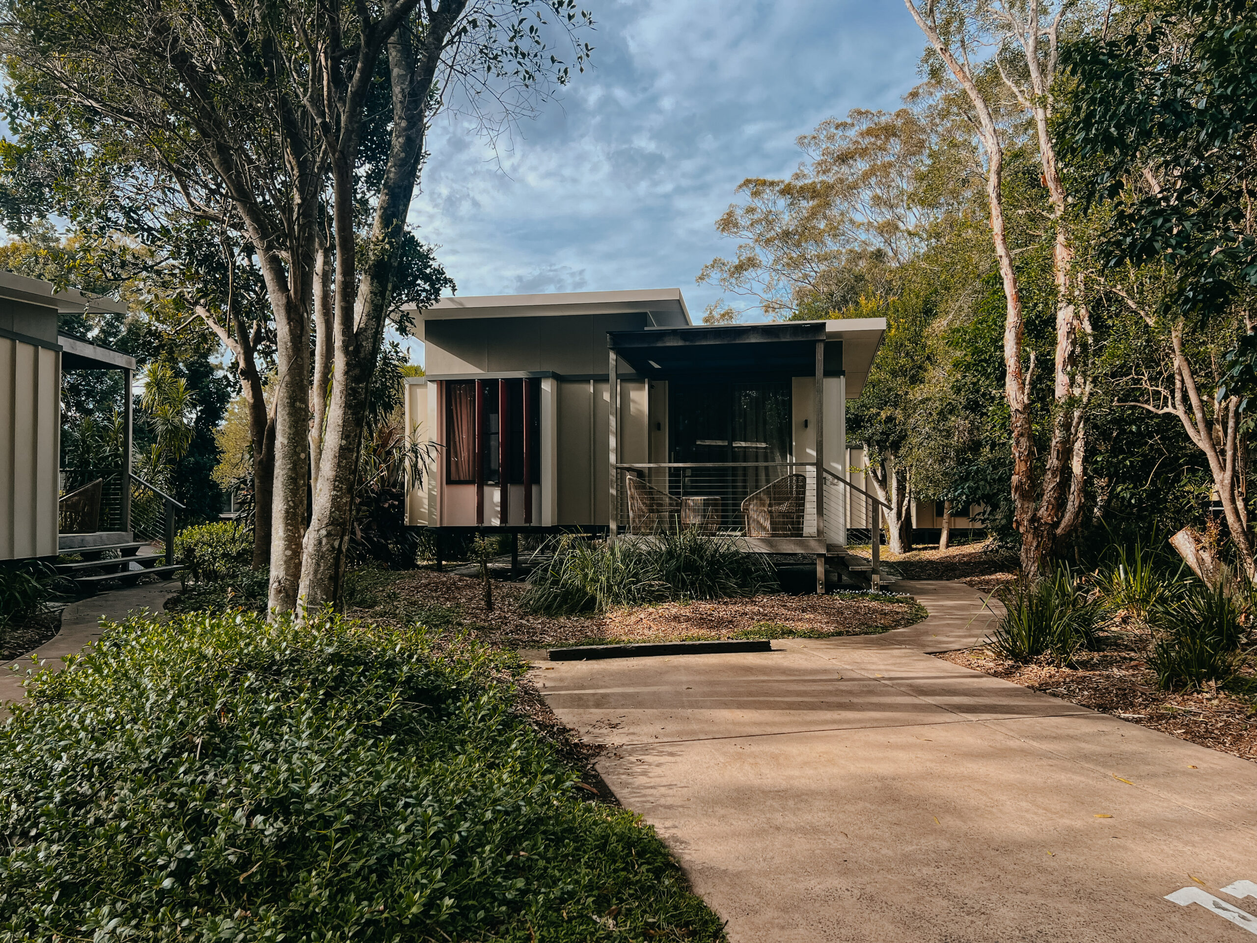 Villa exterior at Elements of Byron set among coastal greenery