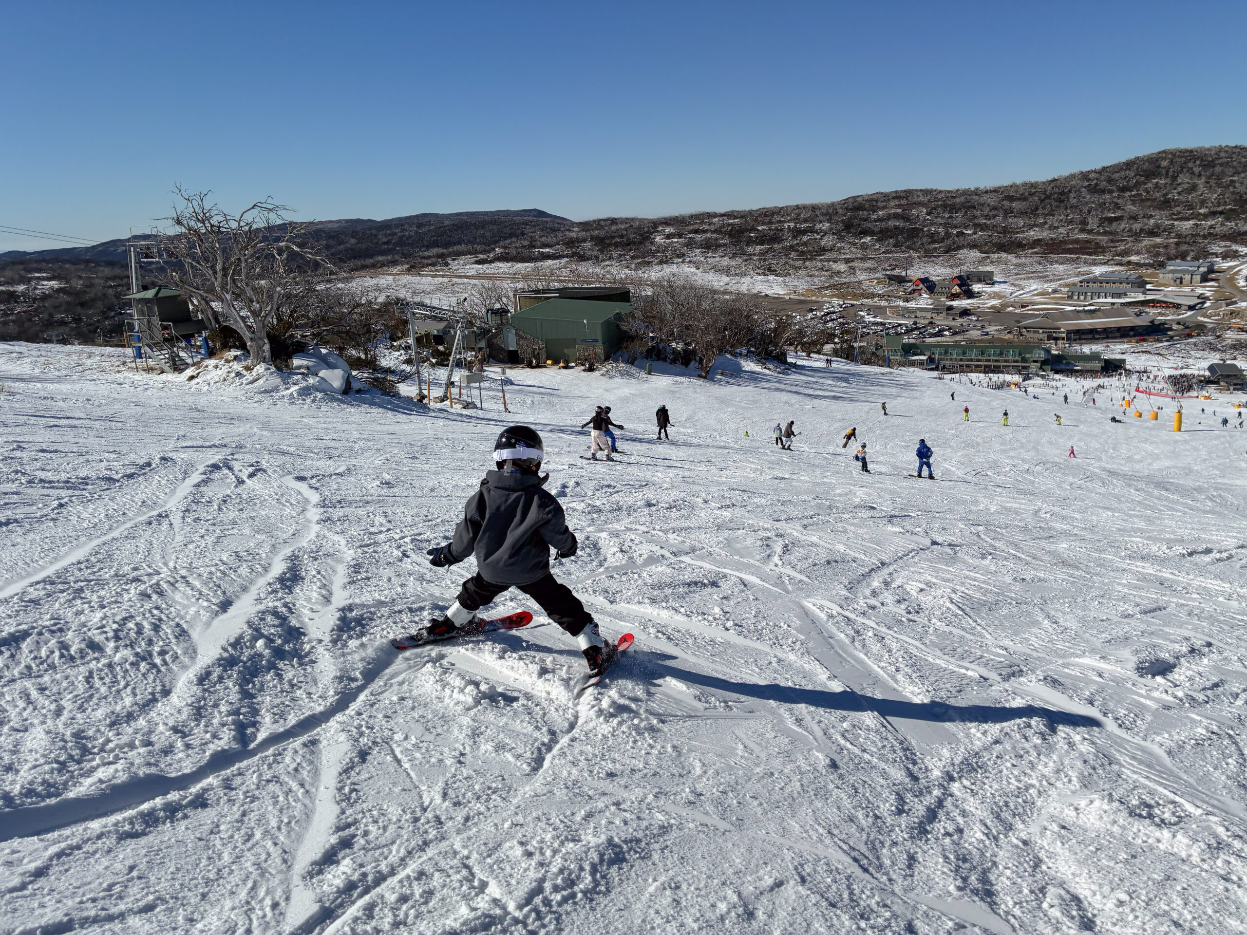 A toddler skiing down the mountain in Perisher
